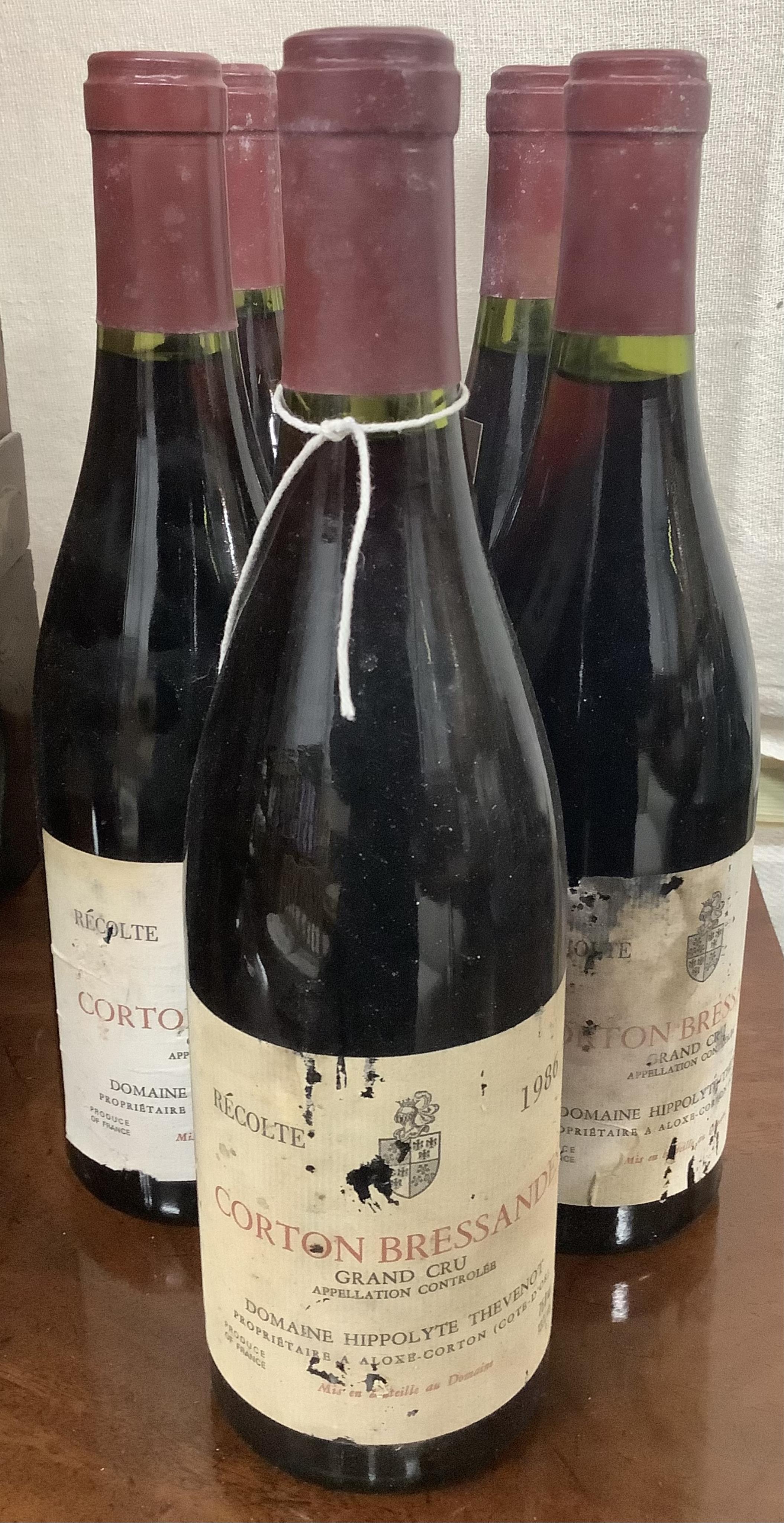 Nine bottles of Domaine Hippolyte Thevenot Corton Bressandes, Recolte Grand Cru 1986. Condition - fair, from a local private cellar